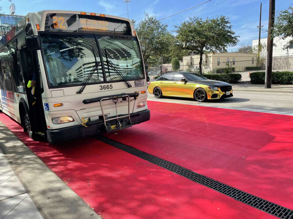 A Route 82 Westheimer bus sits along the new red transit-only lane along Travis Street at Metropolitan Transit Authority's Downtown Transit Center during a shift change Nov. 18, 2021, in Houston.
