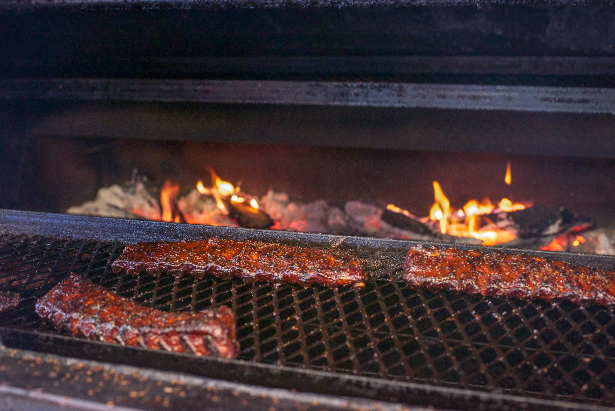 Fancy restaurants in Houston are using live fire barbecue techniques