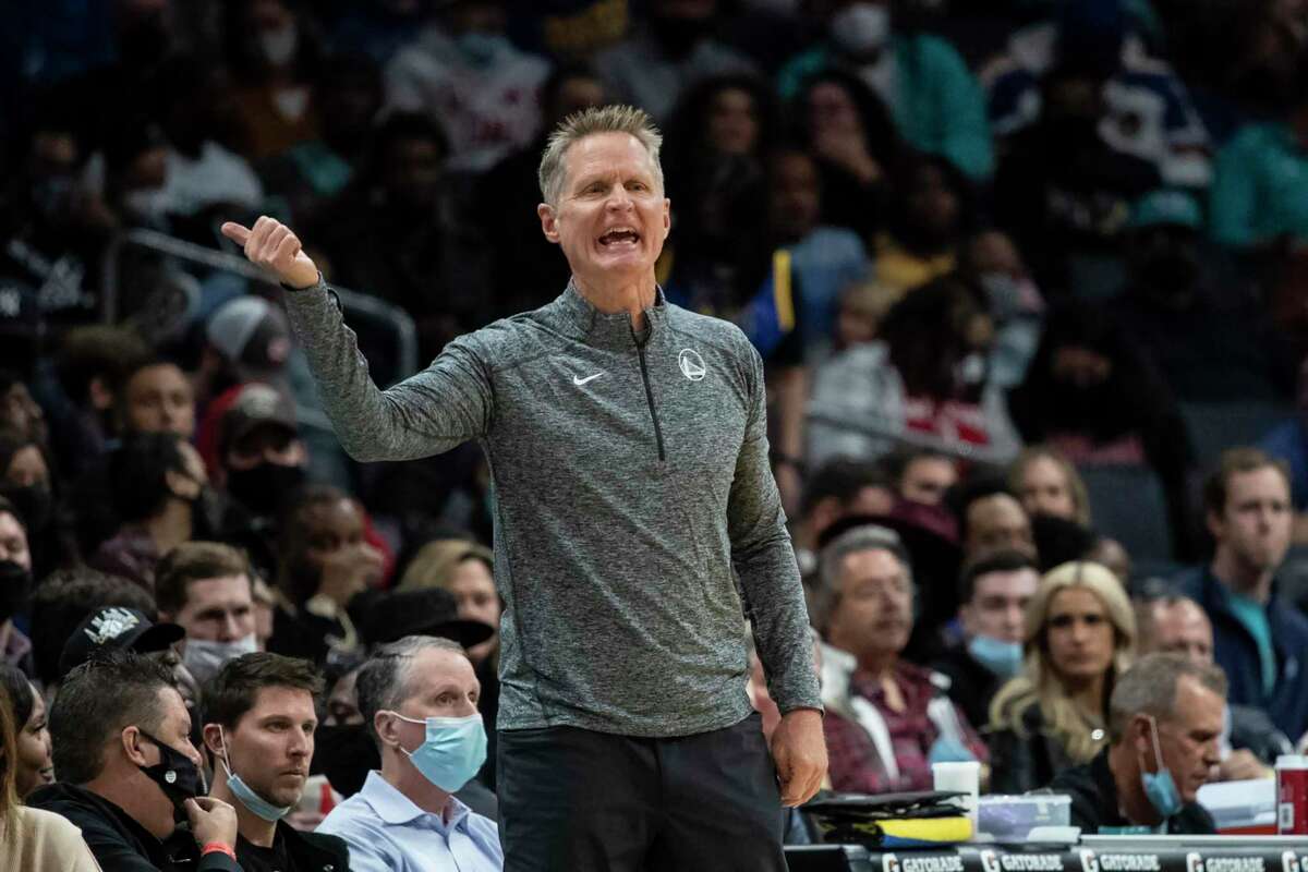 Golden State Warriors head coach Steve Kerr reacts during the first half of an NBA basketball game against the Charlotte Hornets, Sunday, Nov. 14, 2021, in Charlotte, N.C. (AP Photo/Matt Kelley)