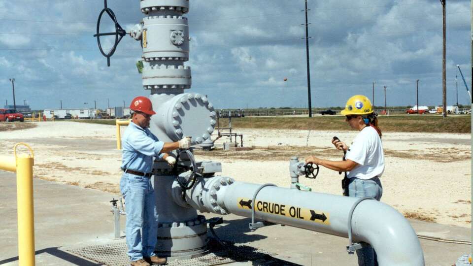 Workers test a wellhead valve at the U.S. Strategic Petroleum Reserve's Bryan Mound facility in Texas in this undated Department of Energy photo. Created in 1975, the Strategic Petroleum Reserve is held in salt caverns along the Gulf Coast of Texas and Louisiana and can hold up to 700 million barrels of oil. Source: U.S. Department of Energy/via Bloomberg News