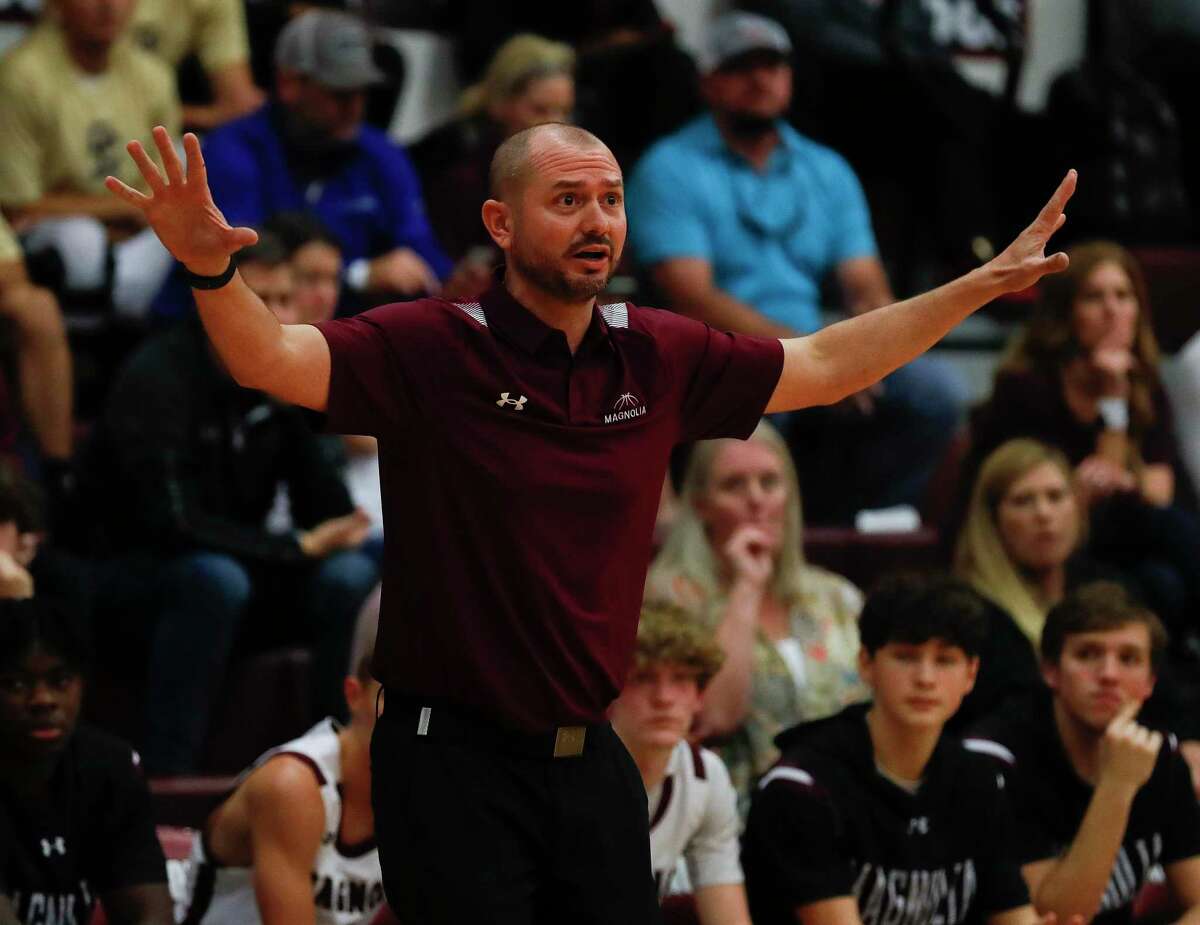 Magnolia head coach Derek Cain instructs players in a game during the Doghouse Invitational basketball tournament at Magnolia High School, Nov. 18, 2021, in Magnolia.