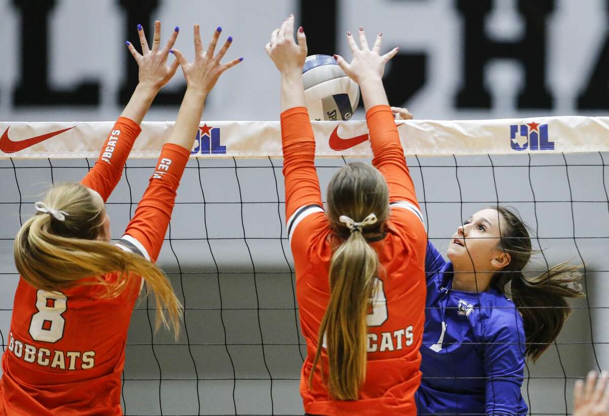 Needville senior Alyssa Edwards (1) spikes the ball as Celina junior Payton Grubbs (8) and senior Megan Hodges (9) block during a high school Class 4A semifinals volleyball match, Thursday, November 18, 2021. Needville lost in three straight matches. Special to the Houston Chronicle/Brandon Wade.