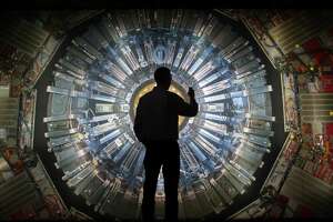 A large back lit image of the Large Hadron Collider at the Science Museum in London, England.