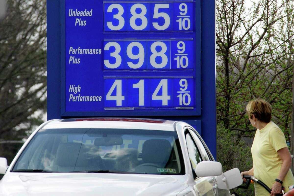 In this March 19, 2012, photo, a motorist pumps gas at a Mount Lebanon, Pa., mini-mart. A statistical analysis of 36 years of monthly inflation-adjusted gasoline prices and U.S. domestic oil production by The Associated Press shows no statistical correlation between how much oil comes out of U.S. wells and the price at the pump. (AP Photo/Gene J. Puskar)