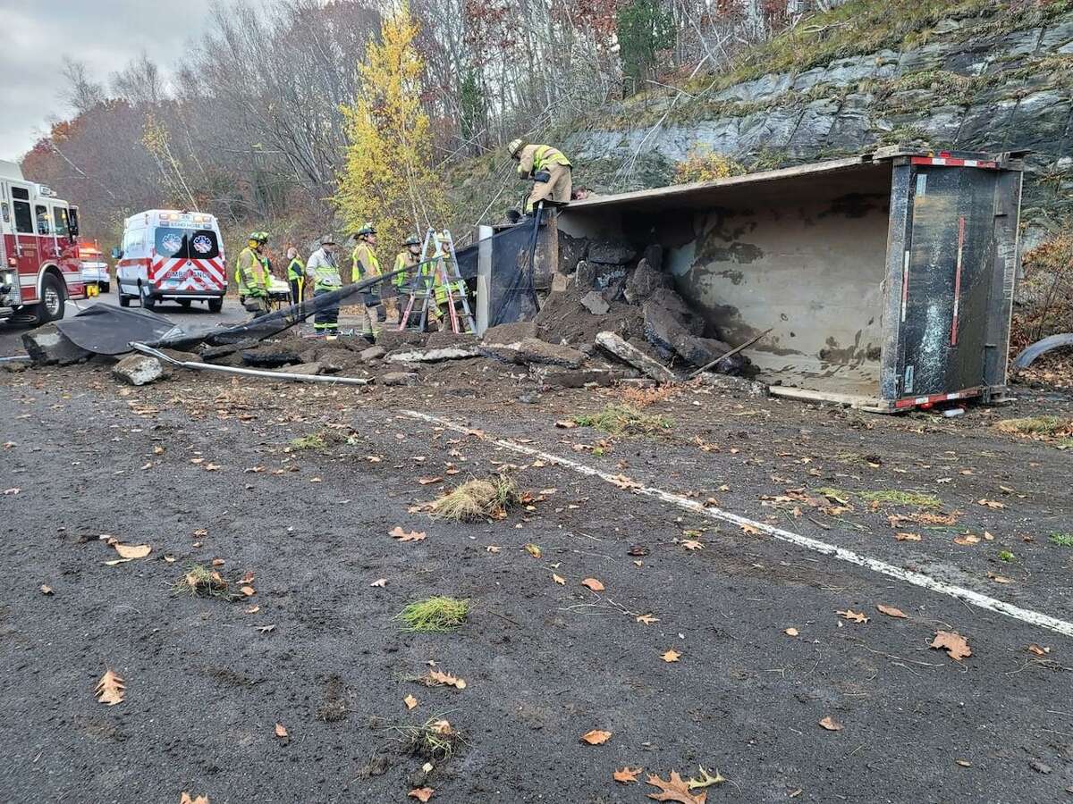 State police confirmed around 8:30 that troopers from the Troop I barracks were on scene near Exit 13 in Shelton, Conn., on Friday, Nov. 19, 2021, for a dump truck rollover. The right and center lanes are expected to be closed for several hours for cleanup.