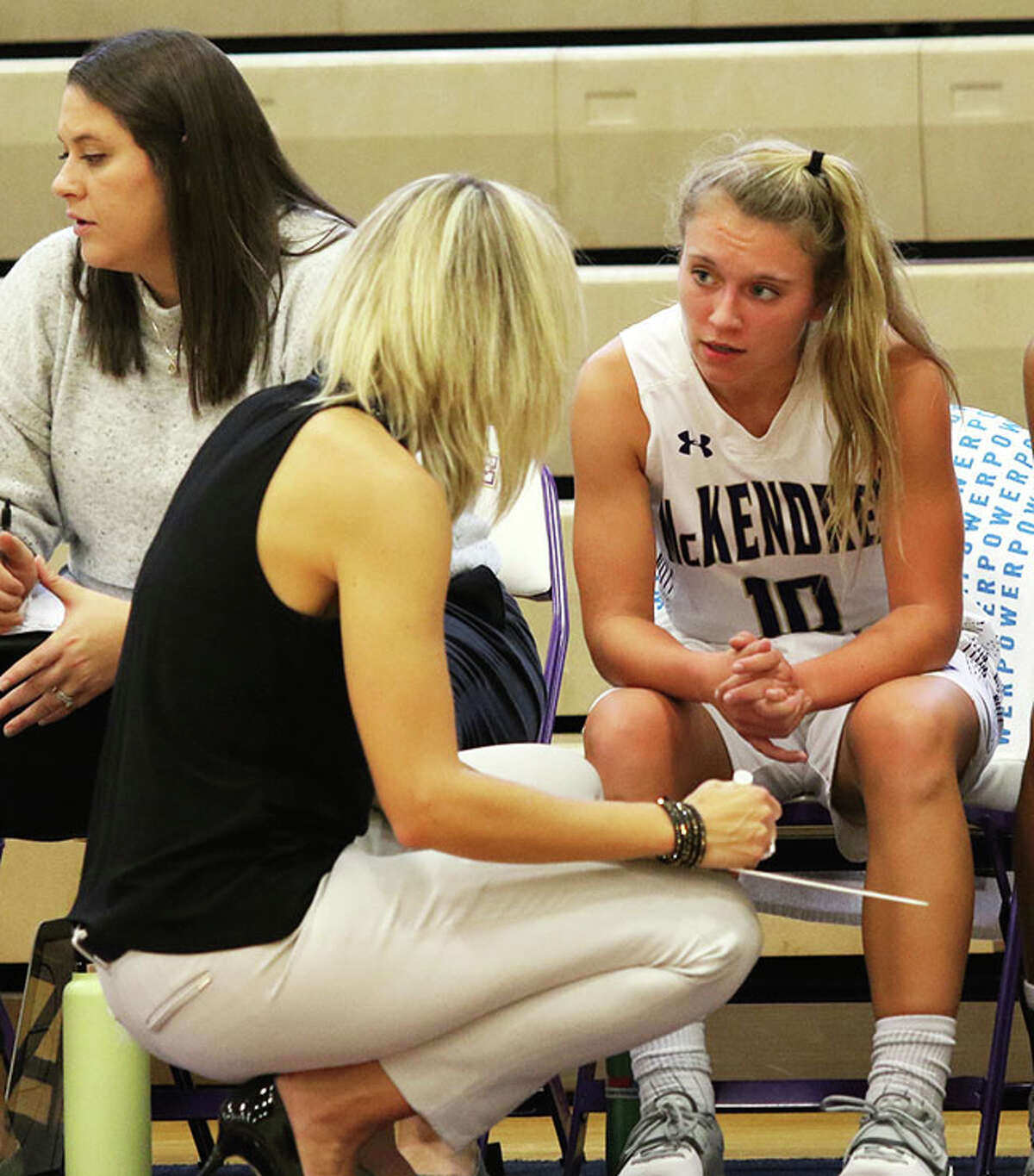 McKendree's Clare Breden (right) listens to Bearcats coach Kari Kerkhoff during their teams game against Tiffin on Nov. 12 in Lebanon.