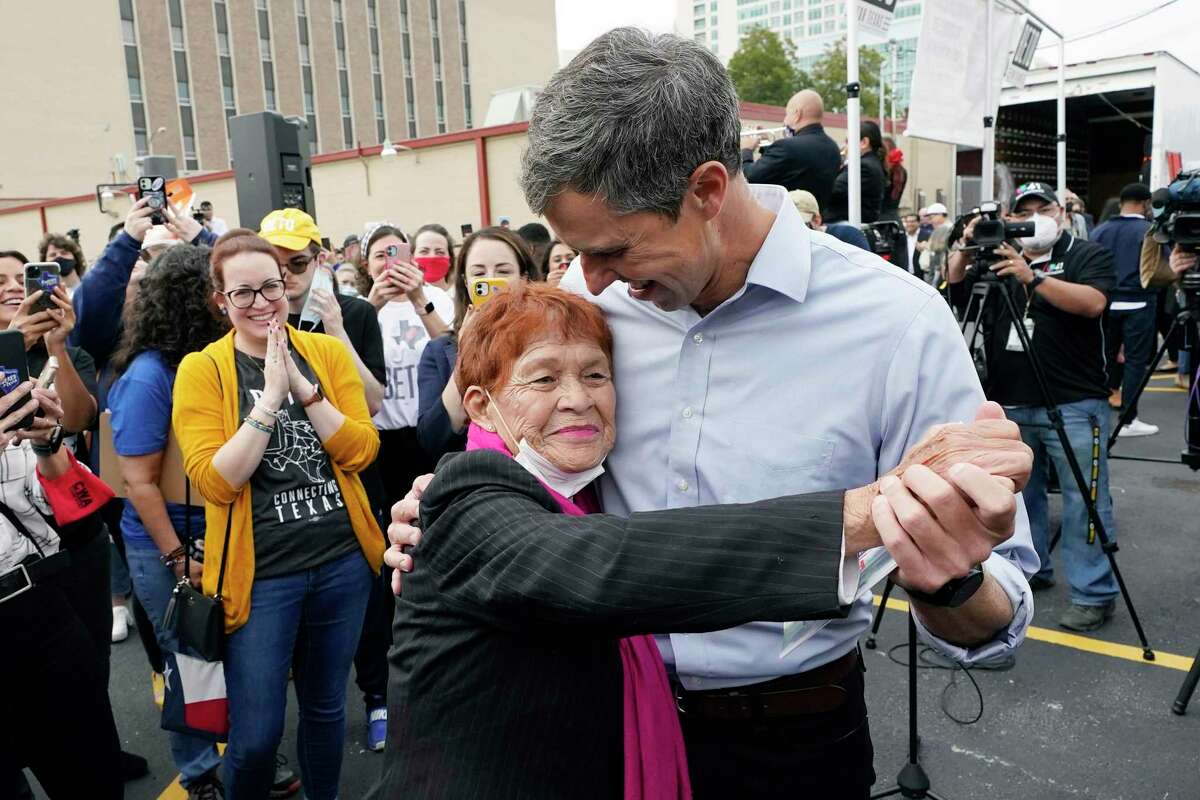 Democrat Beto O'Rourke, right, dances with supporter Henrietta LaGrange during a campaign stop, Tuesday, Nov. 16, 2021, in San Antonio. O'Rourke announced Monday that he will run for Texas governor. (AP Photo/Eric Gay)