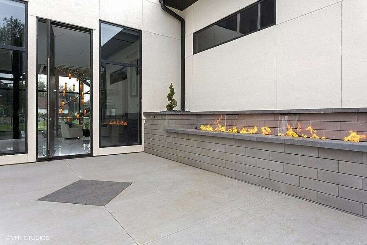 Front door with walkway fireplace.