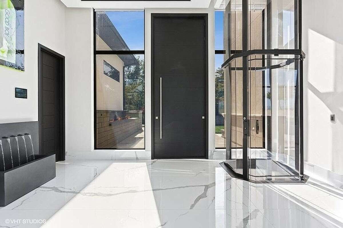 View of elevator and front door from inside the house.