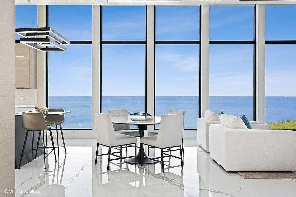 Table in front of floor-to-ceiling windows.