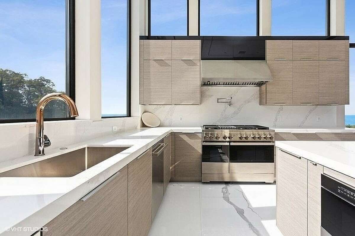 Kitchen area with sink and stove.