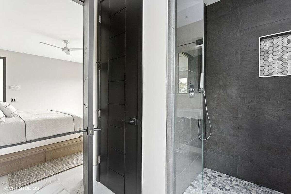 Adjoining bathroom with shower.