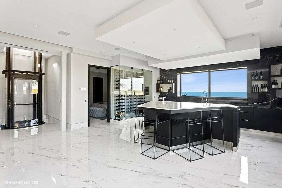 Bar area with wine cellar.