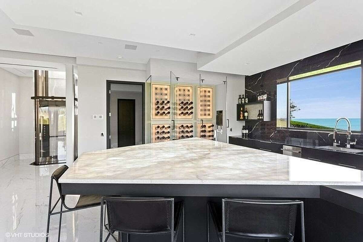 Bar area with wine cellar and sink.