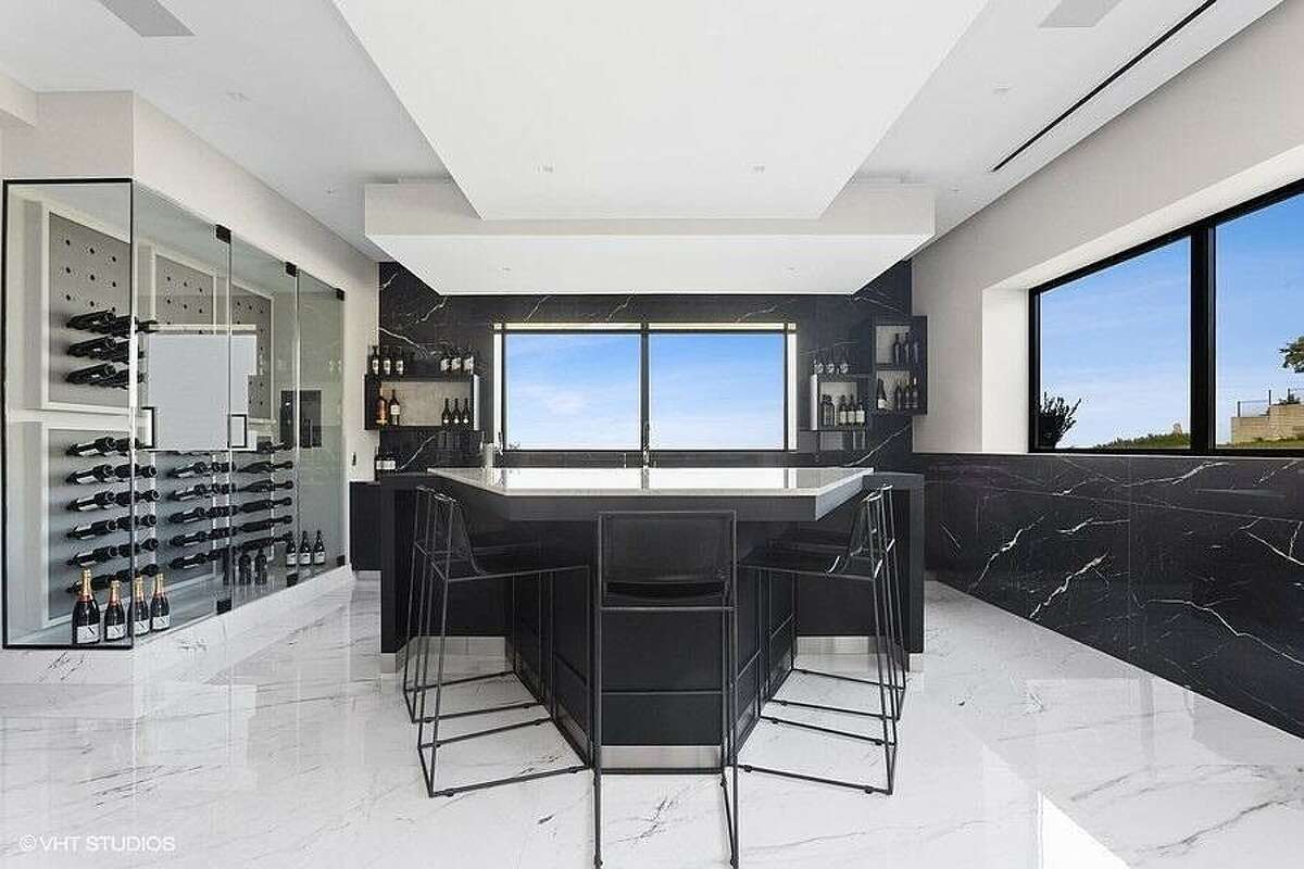 Bar area with wine cellar.