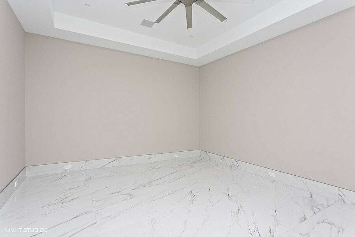 Room with marble flooring.