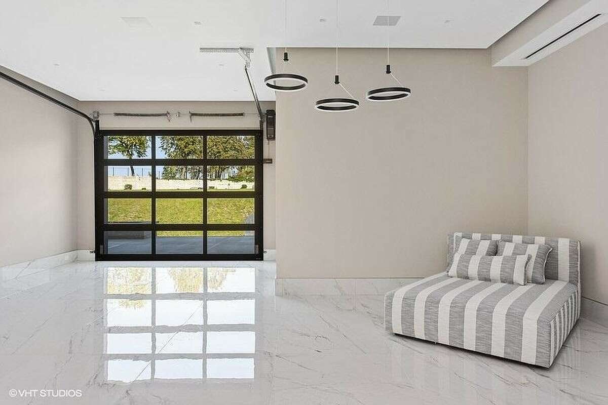 Open area with seating and an overhead door.