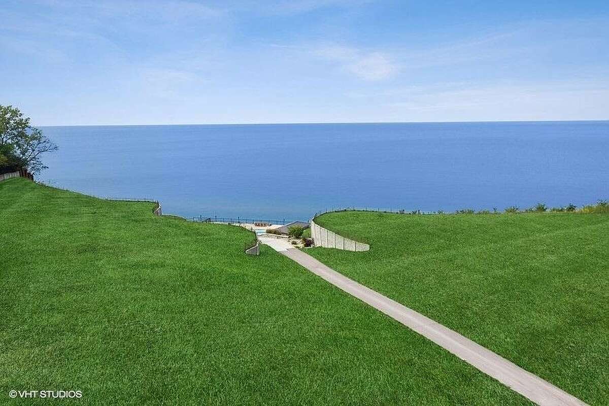 Land and walkway with view of the lake.