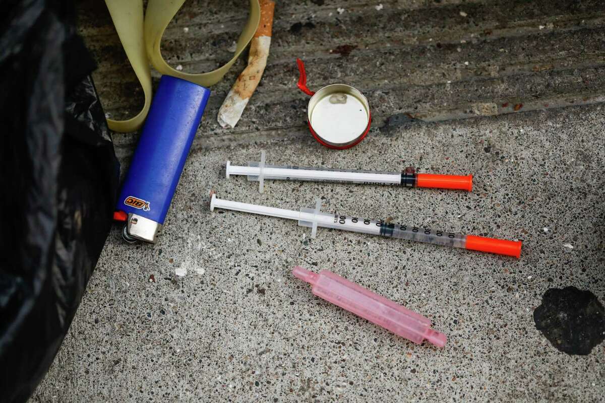 Syringes used to inject fentanyl are seen on Willow Street, an alleyway often lined with tents where drug use is common