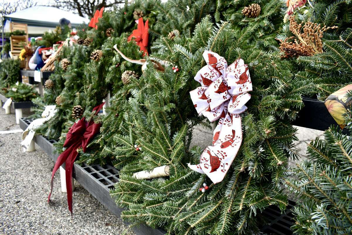 This year's Christmas market in downtown Big Rapids drew residents and shoppers and featured gourmet popcorn stand, jewelry sellers, and a booth selling wreaths of various sizes as well as painted gourds. 