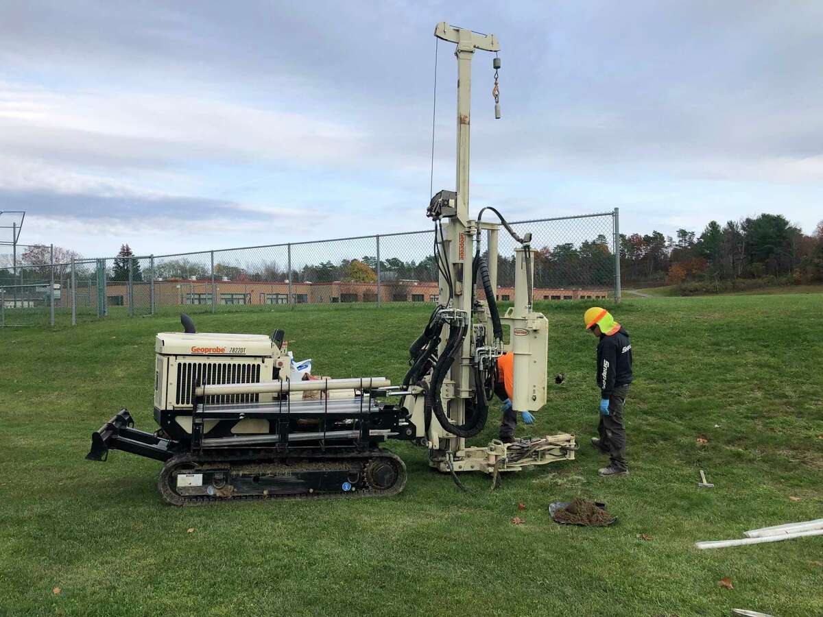 Crews sample for PFOA contamination near Algonquin Middle School in Poestenkill, N.Y. The source of contamination that hit 10 wells has not been found yet.