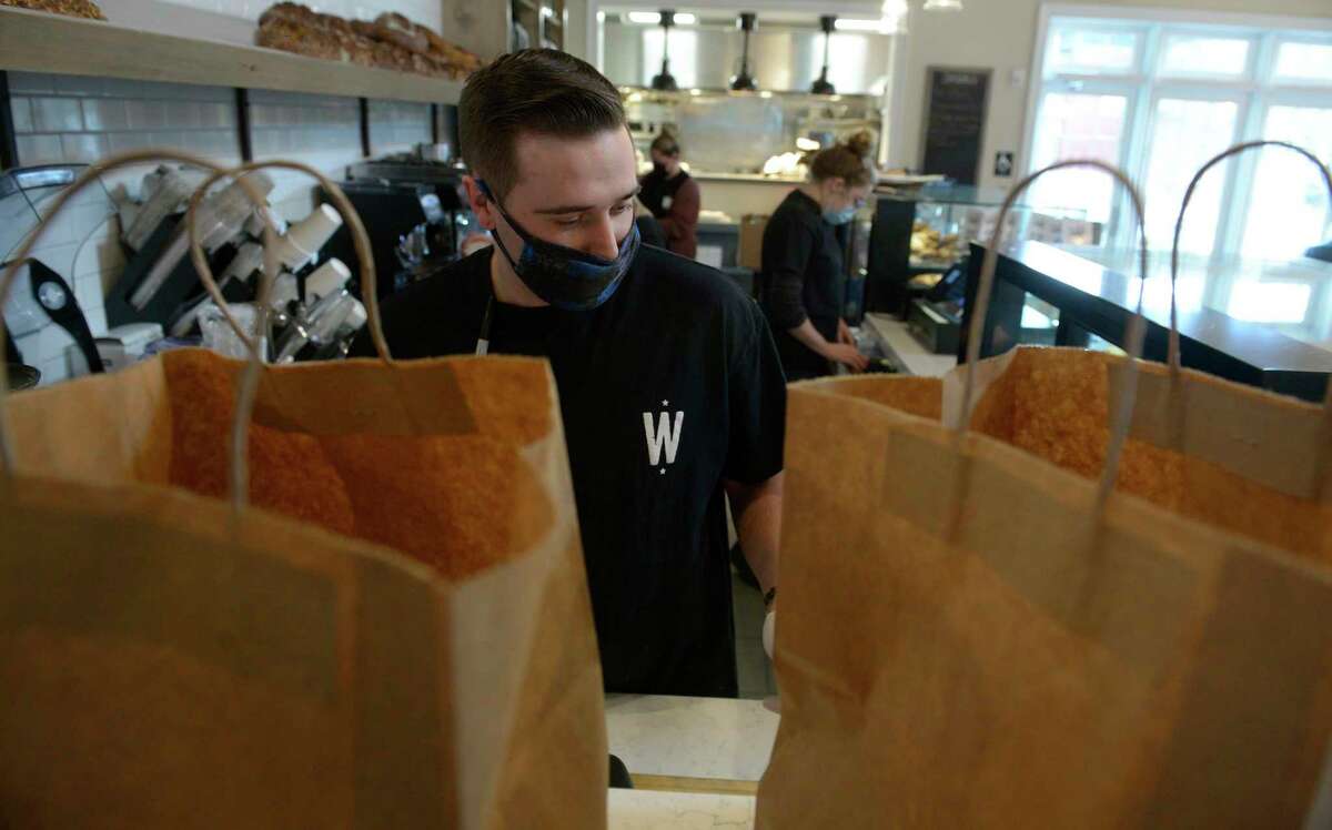 Brian Verrilli works at Wilson’s Bakery & Cafe on North Main Street in Kent on Friday.