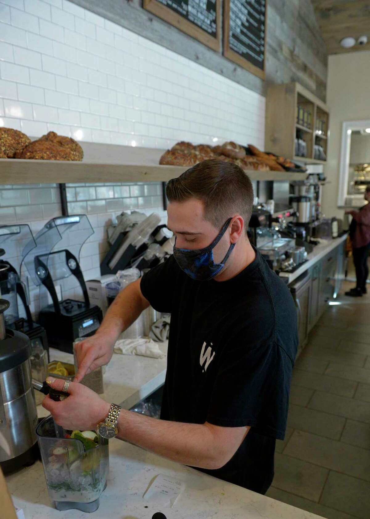 Brian Verrilli works at Wilson’s Bakery & Cafe on North Main Street in Kent, Conn, on Friday, November 19, 2021.
