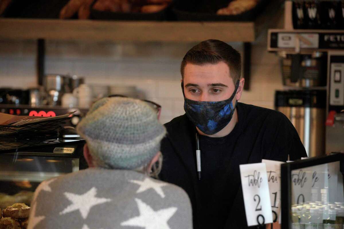 Brian Verrilli works at Wilson’s Bakery & Cafe on North Main Street in Kent, Conn, on Friday, November 19, 2021.