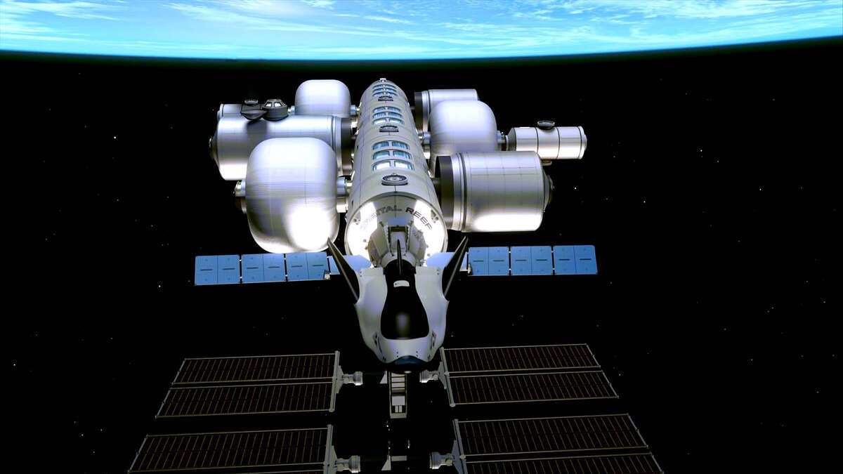 An artist rendering shows what Sierra Space's Dream Chase spaceplane would look like docked with the Oribital Reef commercial space station. The company is partnering with Blue Origin to build the habitat, and hopes to fly astronauts on Dream Chaser by 2025. MUST CREDIT Handout image courtesy of Sierra Space