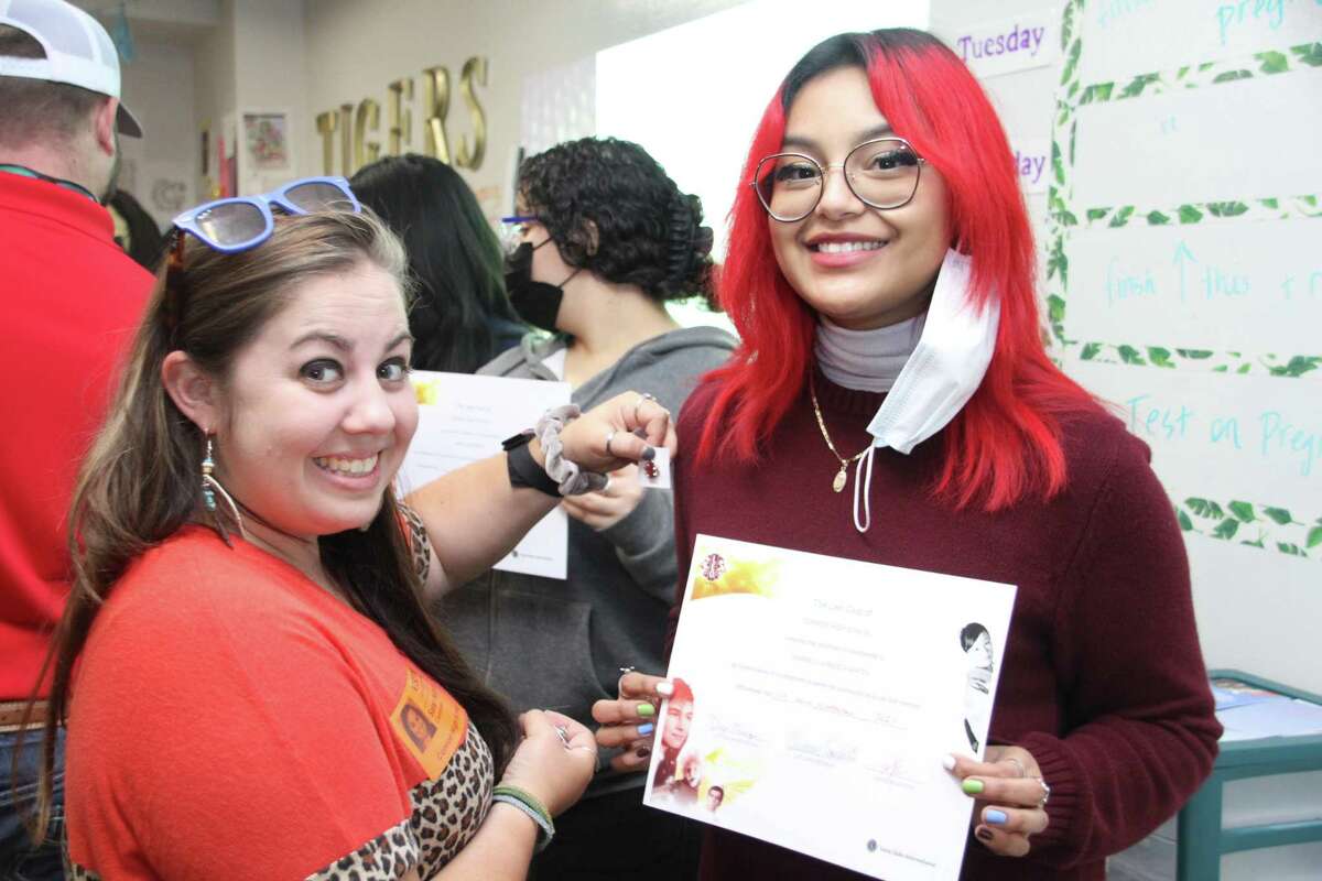 Conroe Noon Lions Club member and CHS Leo Club Liaison Sarah McClure (l) congratulates new Leo Gabriela Jurado Fuentes (r) on receiving her Leo Club pin and membership certificate during last week’s induction ceremony.