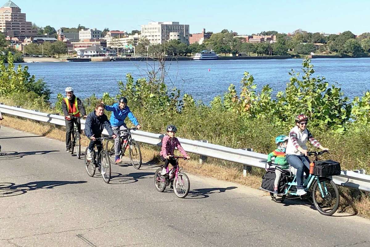 In 2019, people took part in a community bike ride on River Road in Middletown.