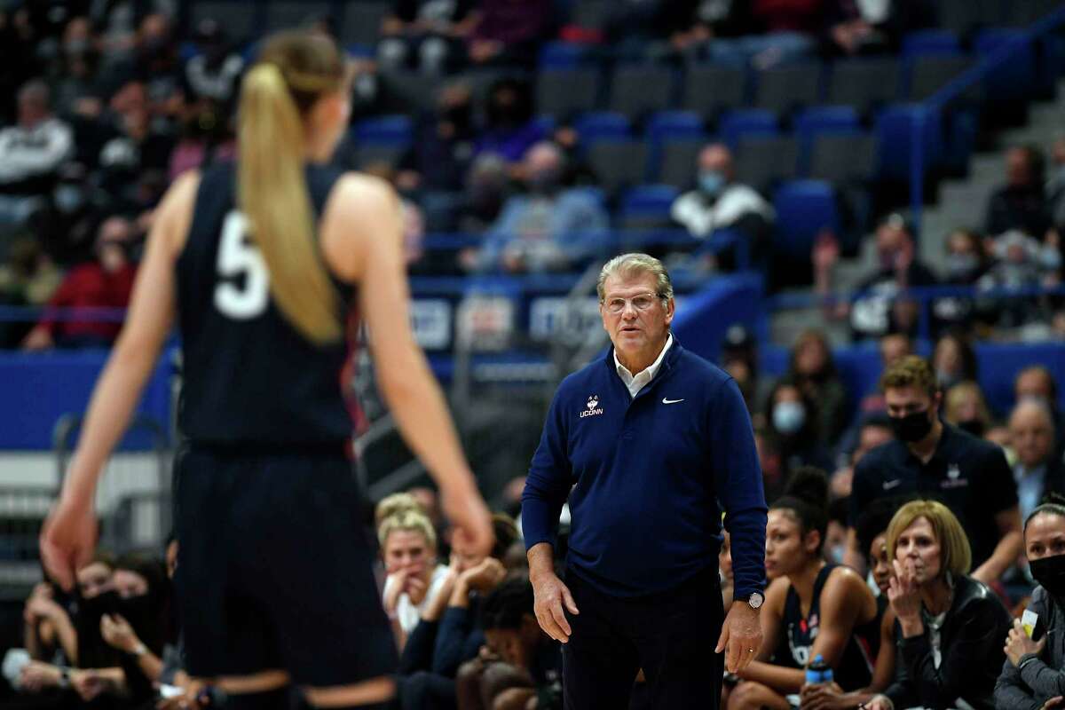 UConn head coach Geno Auriemma with Connecticut's Paige Bueckers in the first half of an NCAA college basketball game, Sunday, Nov. 14, 2021, in Hartford.