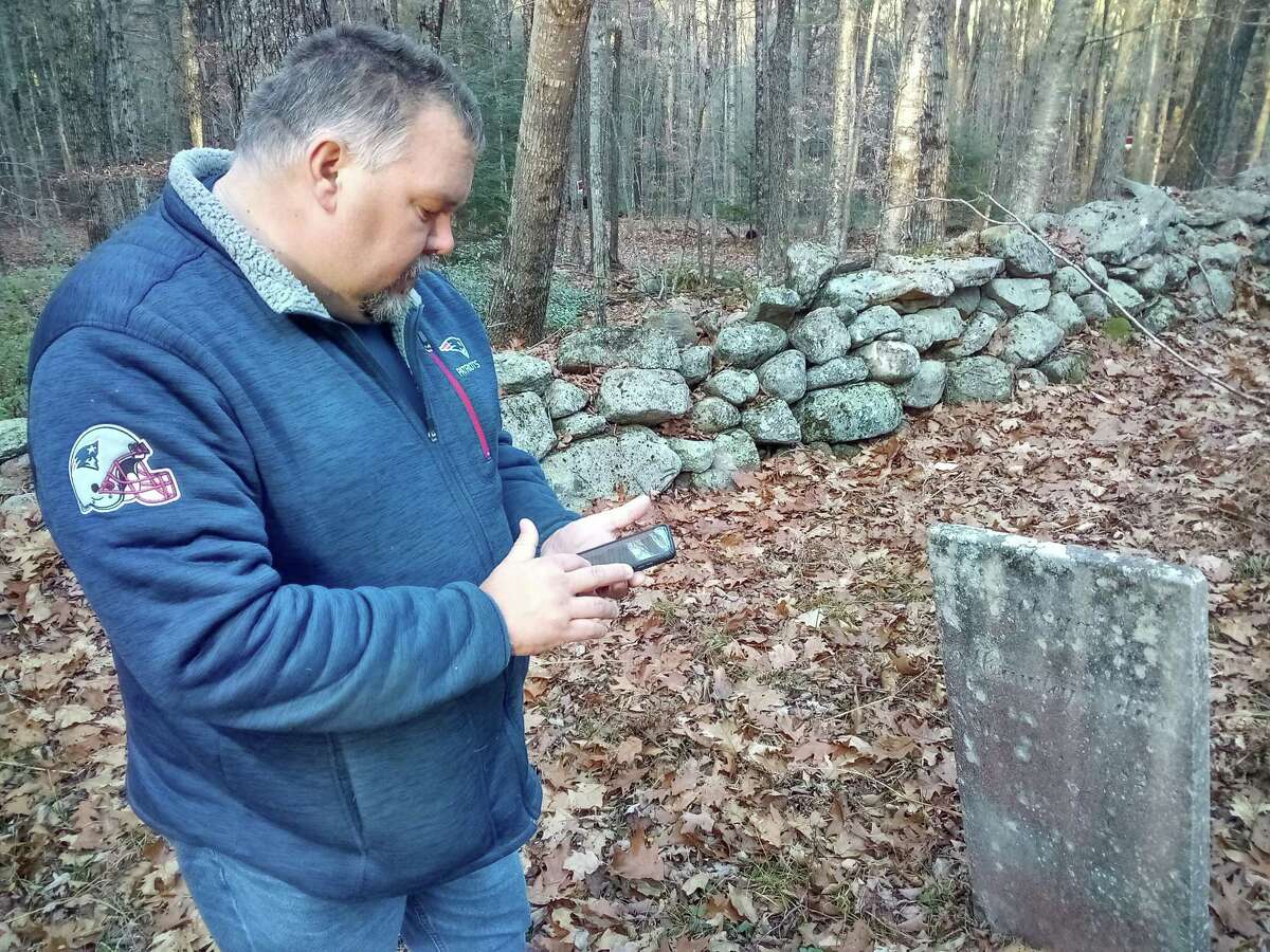 Winsted Mayor Todd Arcelaschi at the Danbury Quarter Road cemetery, one of the town's oldest burial sites near Winchester Center. It is inaccessible, mostly because of the condition of the dirt road, filled with potholes, standing water and deep ruts, as well as steep inclines. But the mayor wants to find a way to record who is buried there, clean up the one-acre property and possibly repair some of the many broken headstones.