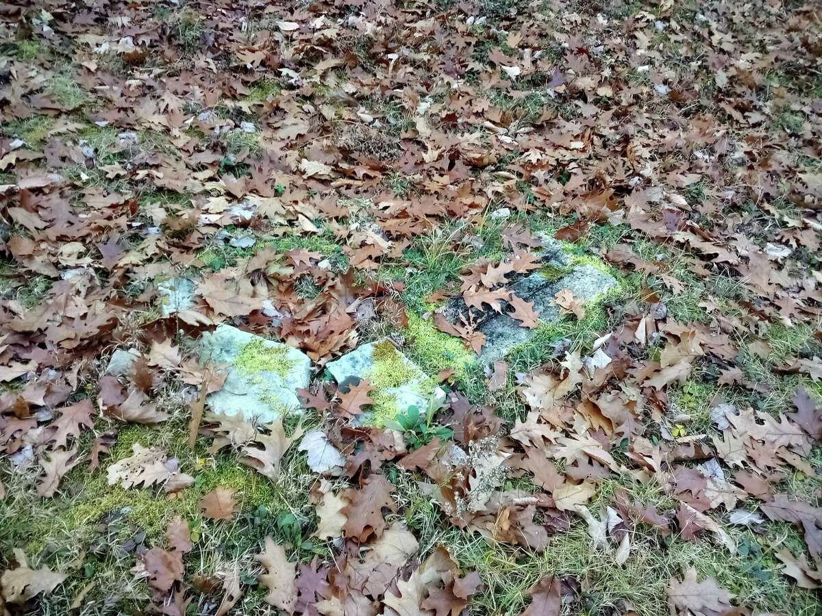 The Danbury Quarter Road cemetery, one of the town's oldest burial sites near Winchester Center, inaccessible, mostly because of the condition of the dirt road, filled with potholes, standing water and deep ruts, as well as steep inclines. Mayor Todd Arcelaschi wants to find a way to record who is buried there, clean up the one-acre property and possibly repair some of the many broken headstones.