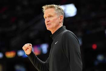 CLEVELAND, OHIO - NOVEMBER 18: Head Coach Steve Kerr of the Golden State Warriors communicates with his players during the second half against the Cleveland Cavaliers at Rocket Mortgage Fieldhouse on November 18, 2021 in Cleveland, Ohio. The Warriors defeated the Cavaliers 104-89. NOTE TO USER: User expressly acknowledges and agrees that, by downloading and/or using this photograph, user is consenting to the terms and conditions of the Getty Images License Agreement. (Photo by Jason Miller/Getty Images)