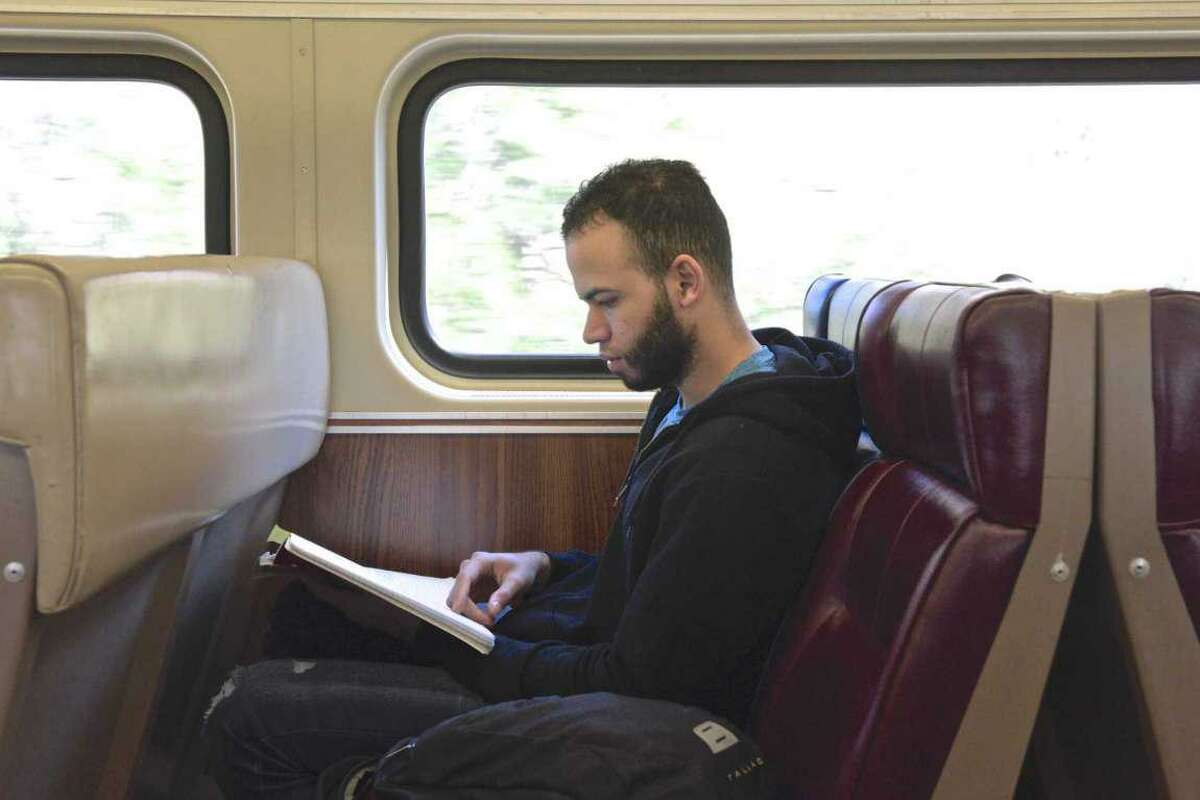 Joel Matos, of Stamford, takes a Metro-North train to Danbury to attend class at Western Connecticut State University.