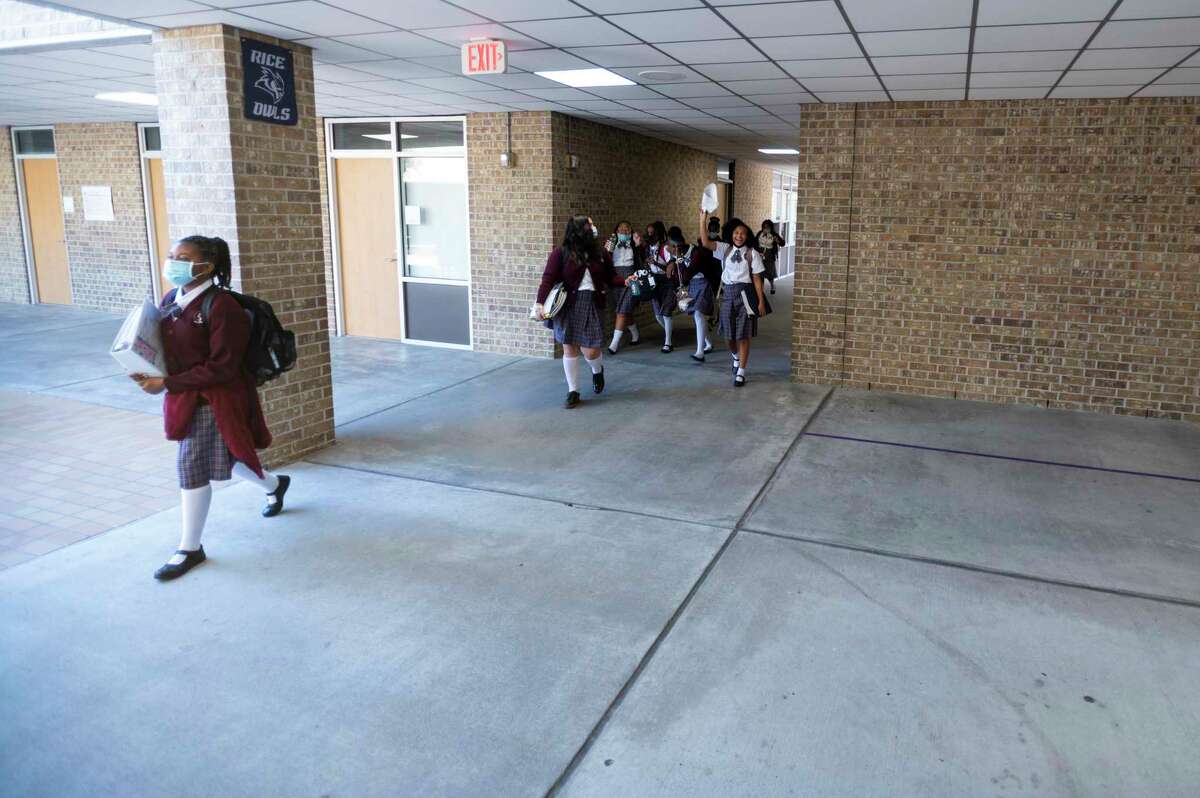 Aldine Young Women’s Leadership Academy students move between classes at the Aldine Young Women’s Leadership Academy at Parker Elementary School Friday, Nov. 19, 2021, in Houston.