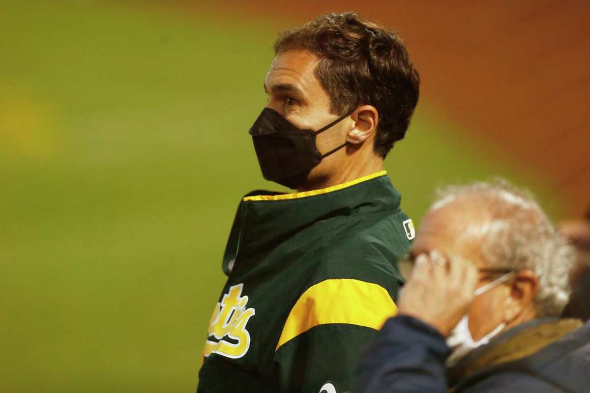 Oakland Athletics president Dave Kaval watches the lights that shut off and caused a game delay in the fifth inning during the second game of an MLB doubleheader at RingCentral Coliseum on Tuesday, April 20, 2021, in Oakland, Calif.