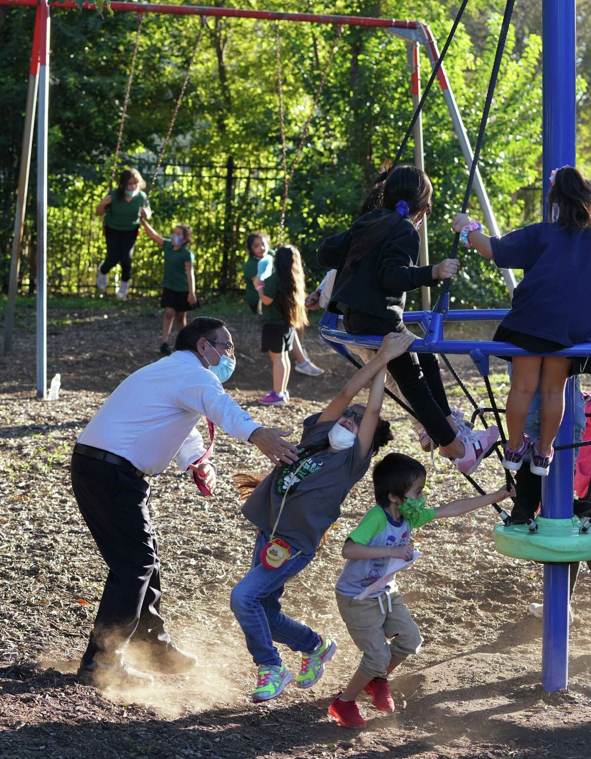 Simon Salas, CEO of Good Samaritan Community Services, participates in outdoor activities with the children he oversees at the nonprofit, which offers programs to support children, seniors and low-income residents in the West Side neighborhood where he grew up.
