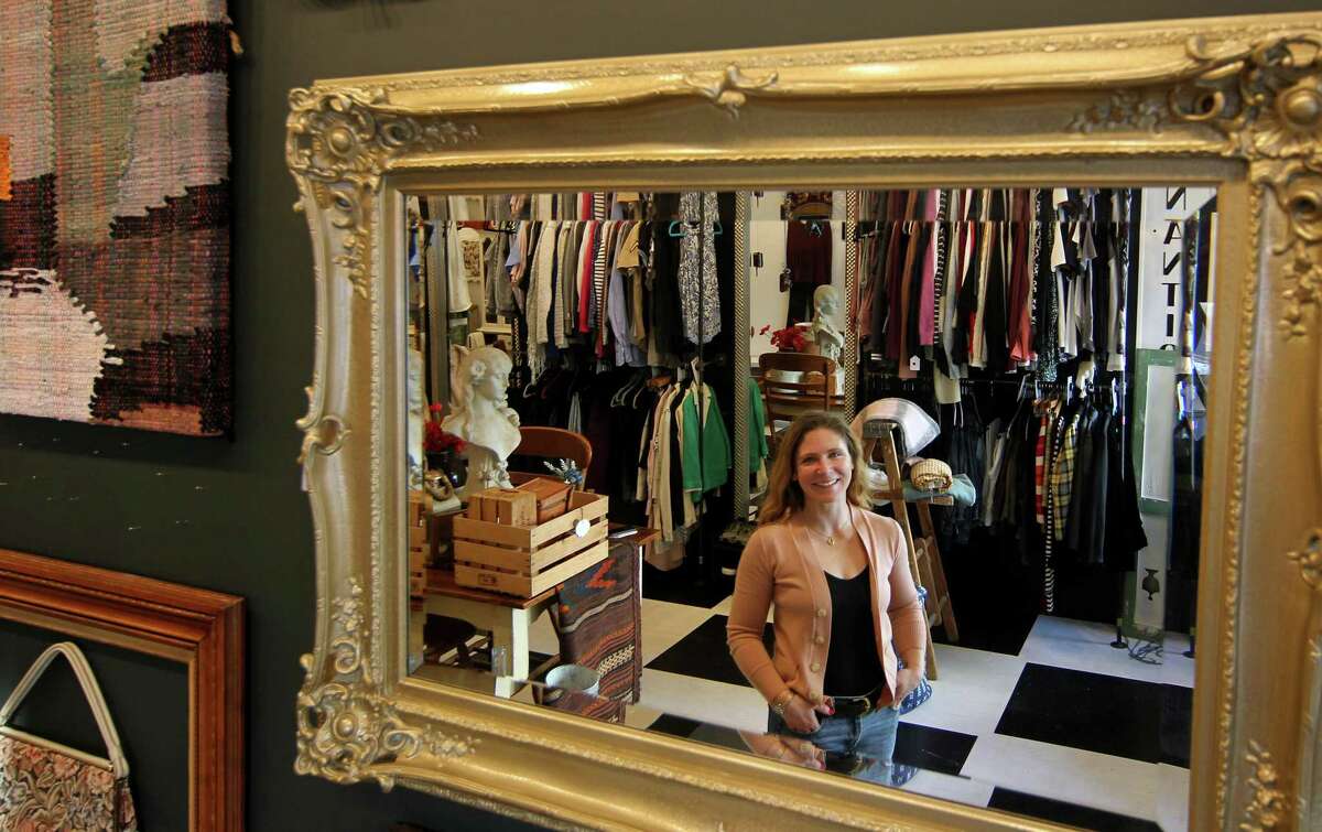 Manager Megan Fronio poses in a new thrift shop in the Byram neighborhood in Greenwich, Conn., on Thursday November 18, 2021. A revitalization of sorts is happening in the area, with new business and residential construction popping up.