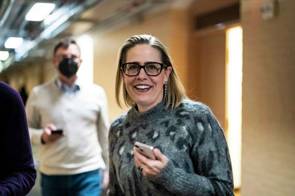 Sen. Kyrsten Sinema, D-Ariz., leaves after an interview Thursday with Washington Post reporters on Capitol Hill.