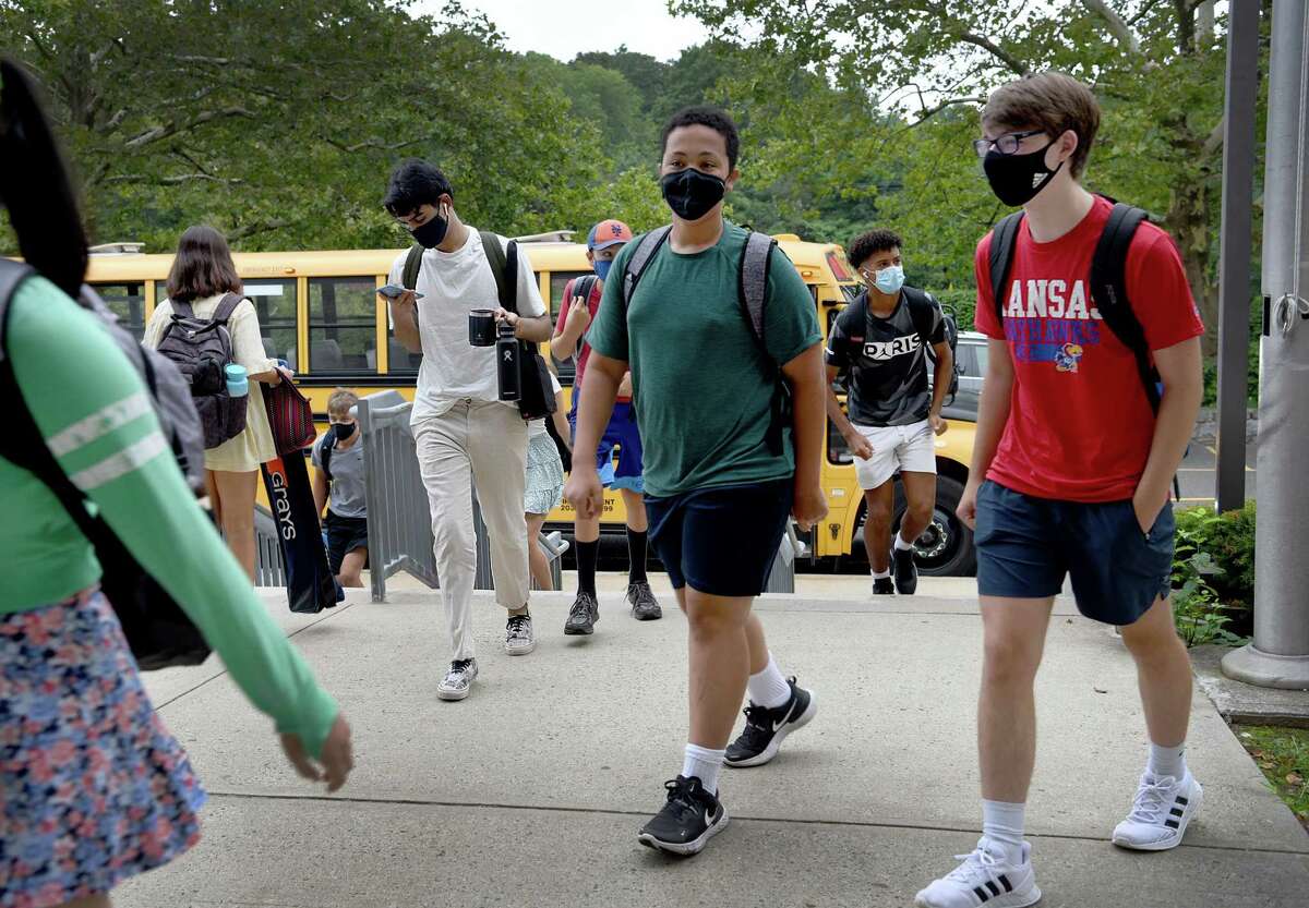 Students arrive for the first day of school in Fairfield, Conn., Monday morning, August 30, 2021.