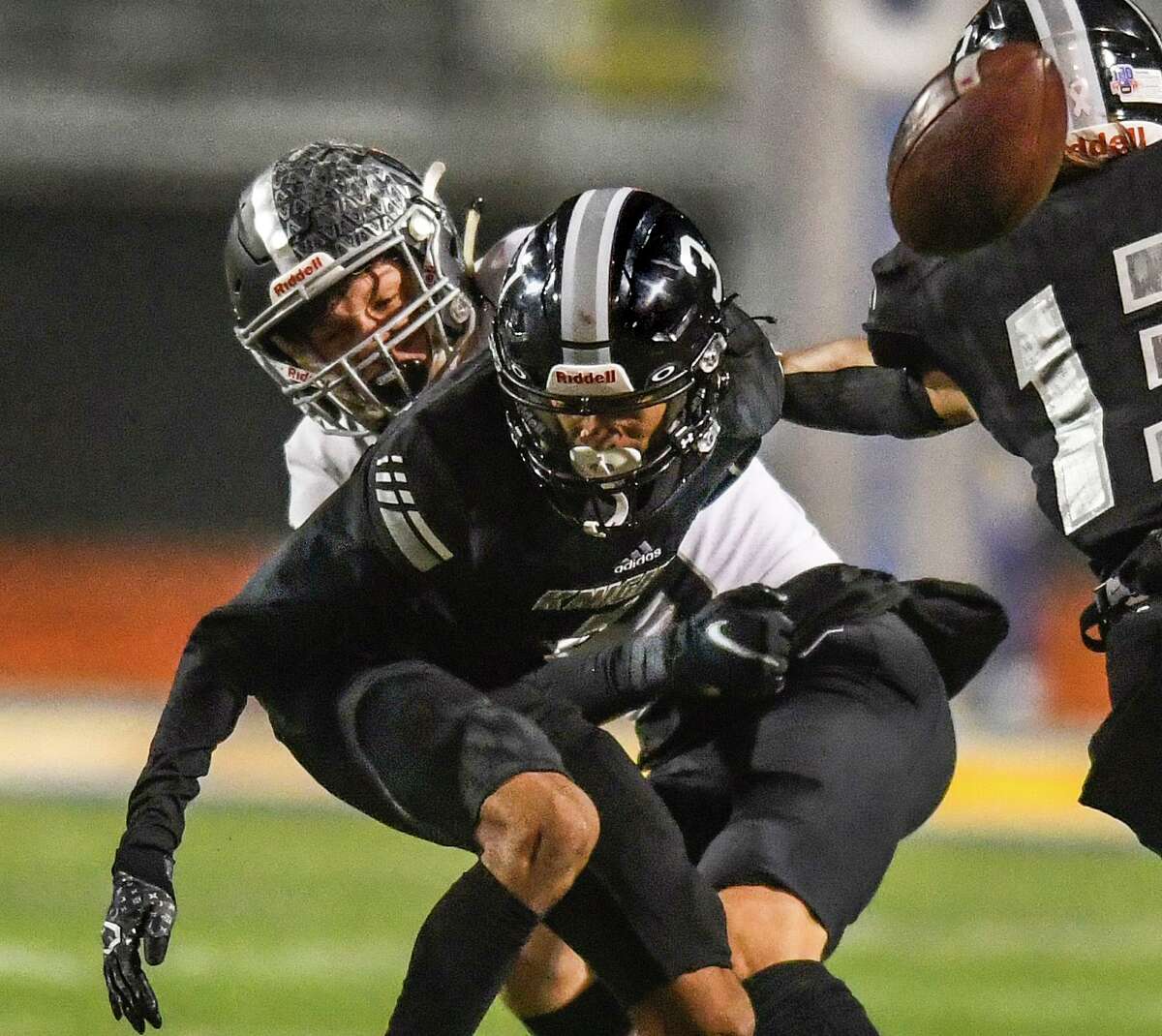 Receiver Edmarrion Contreras (3) of Steele has the ball knocked away by defensive back Jaxon Oliver of Vandegrift during area football playoffs action at Lehnhoff Stadium in Schertz on Friday, Nov. 19, 2021.