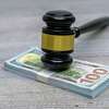 Judge wooden gavel with dollar money banknote concept for bribery