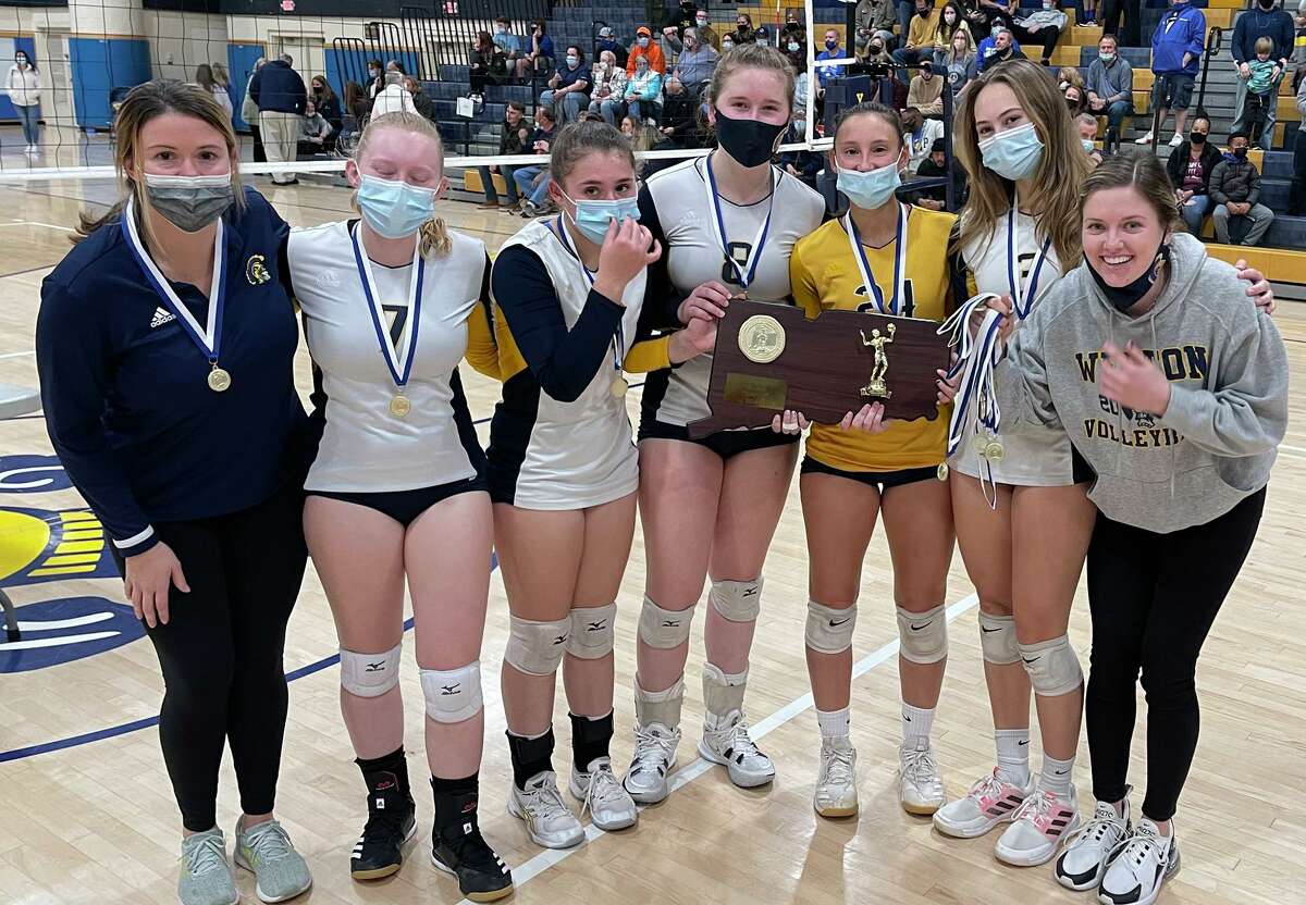 Weston celebrates its CIAC Class M girls volleyball championship on Saturday, Nov. 20, 2021 at East Haven High School in East Haven, Conn.