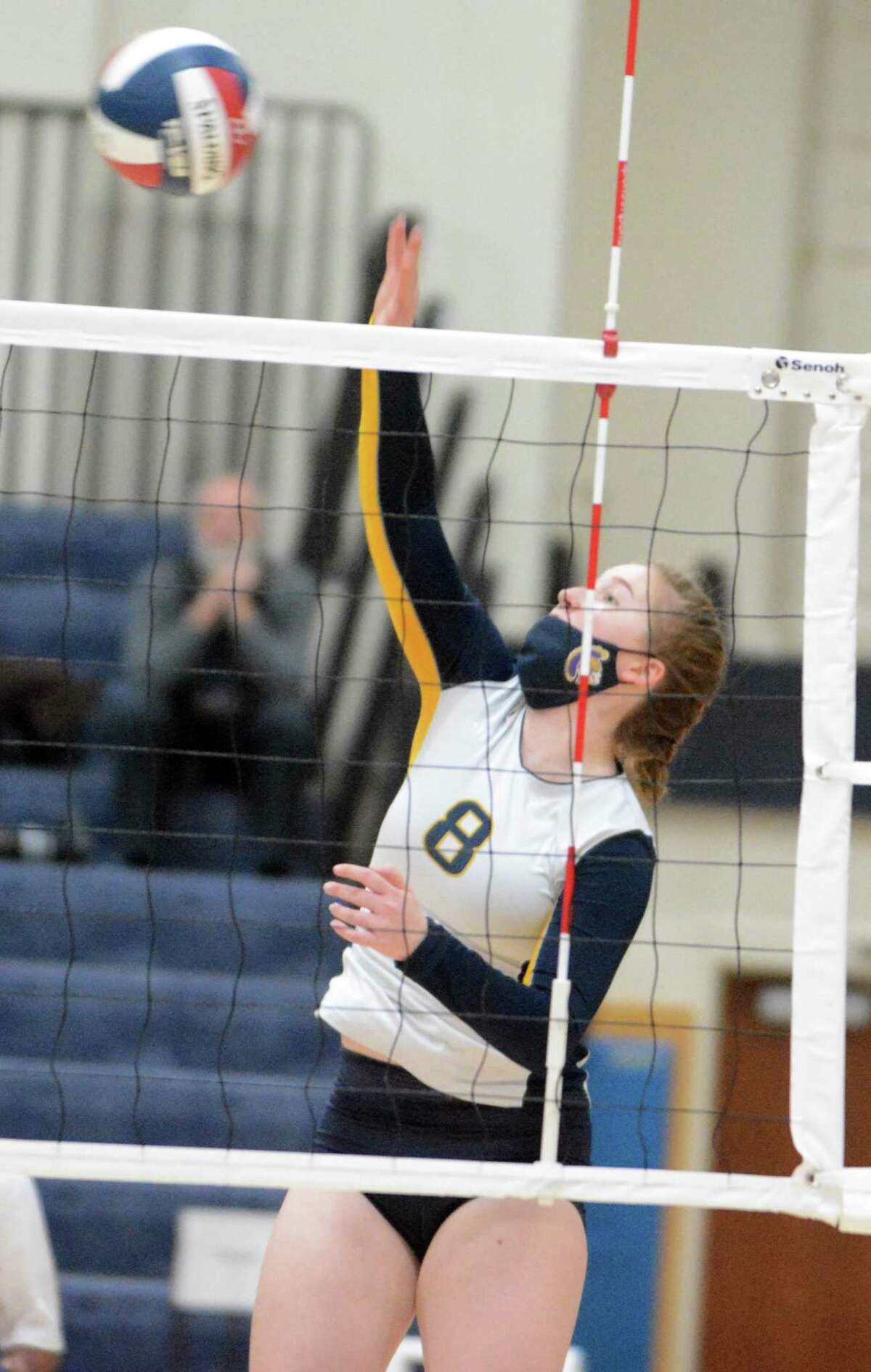 Class M girls volleyball championship MVP Sydney Lyon of Weston fires a kill over the net against Seymour on Saturday, Nov. 20, 2021 at East Haven High School in East Haven, Conn.
