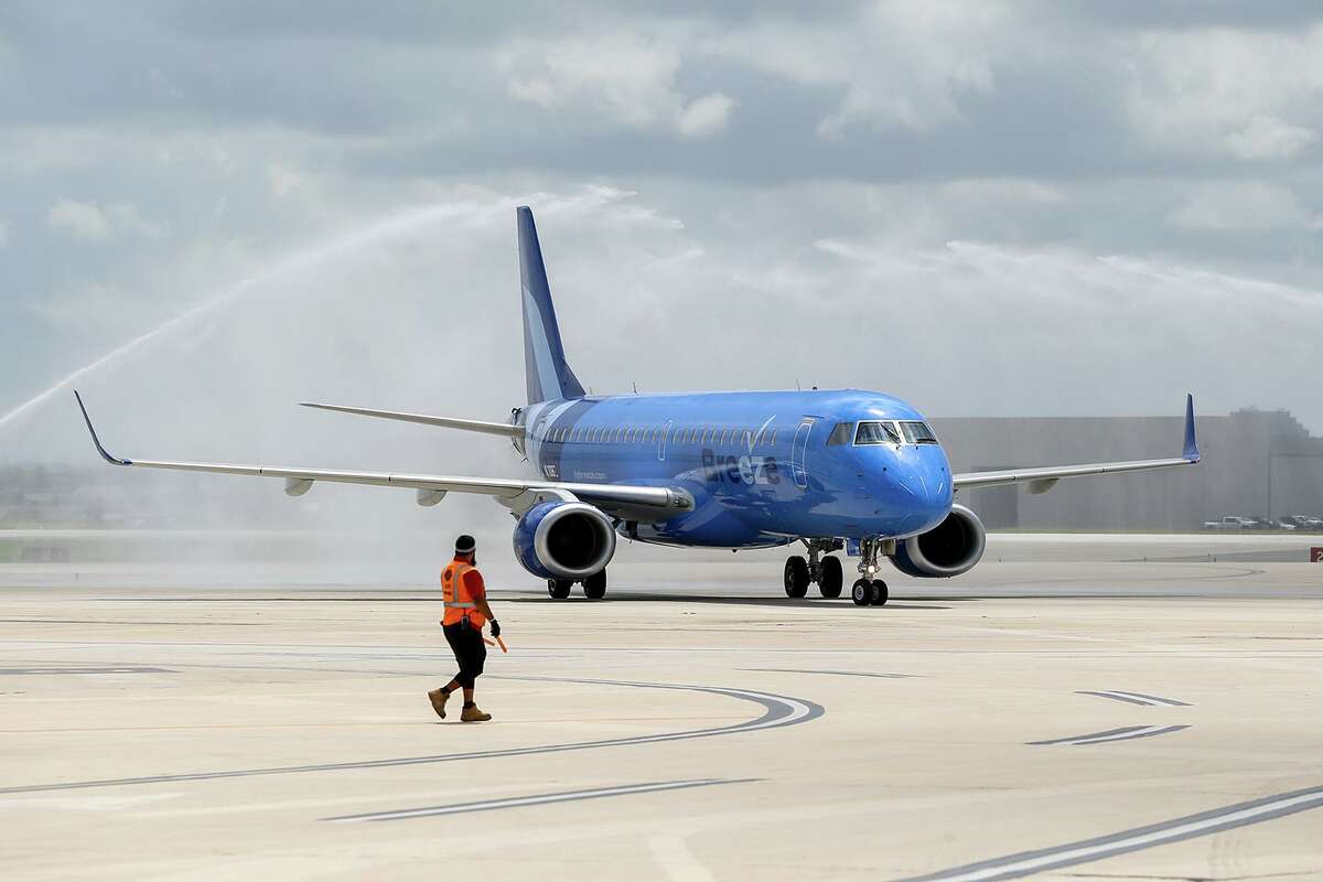 A Breeze Airways jet in July 2021 at San Antonio International Airport. The airline is using Airbus A220 jets that require less runway to take off and land, opening the possibility for smaller airports in cities that have been skipped over by airlines.
