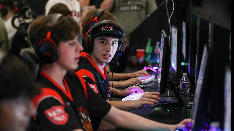 Nico Lopez, 17, competes beside his classmates from St. Thomas High School during an esports competition as top gamers from 15 Houston-area high schools competed against the U.S. Navy’s esports team, “Goats & Glory' at Belong Gaming Arena, Saturday, Nov. 20, 2021 in Pearland. The Navy’s Goats & Glory esports team was established in 2020 to provide a platform for people from all walks of life to engage with Sailors and learn more about the range of opportunities the Navy provides, while sharing a mutual passion for gaming. Hosting tournaments with student gamers from multiple schools represents a new outreach approach.