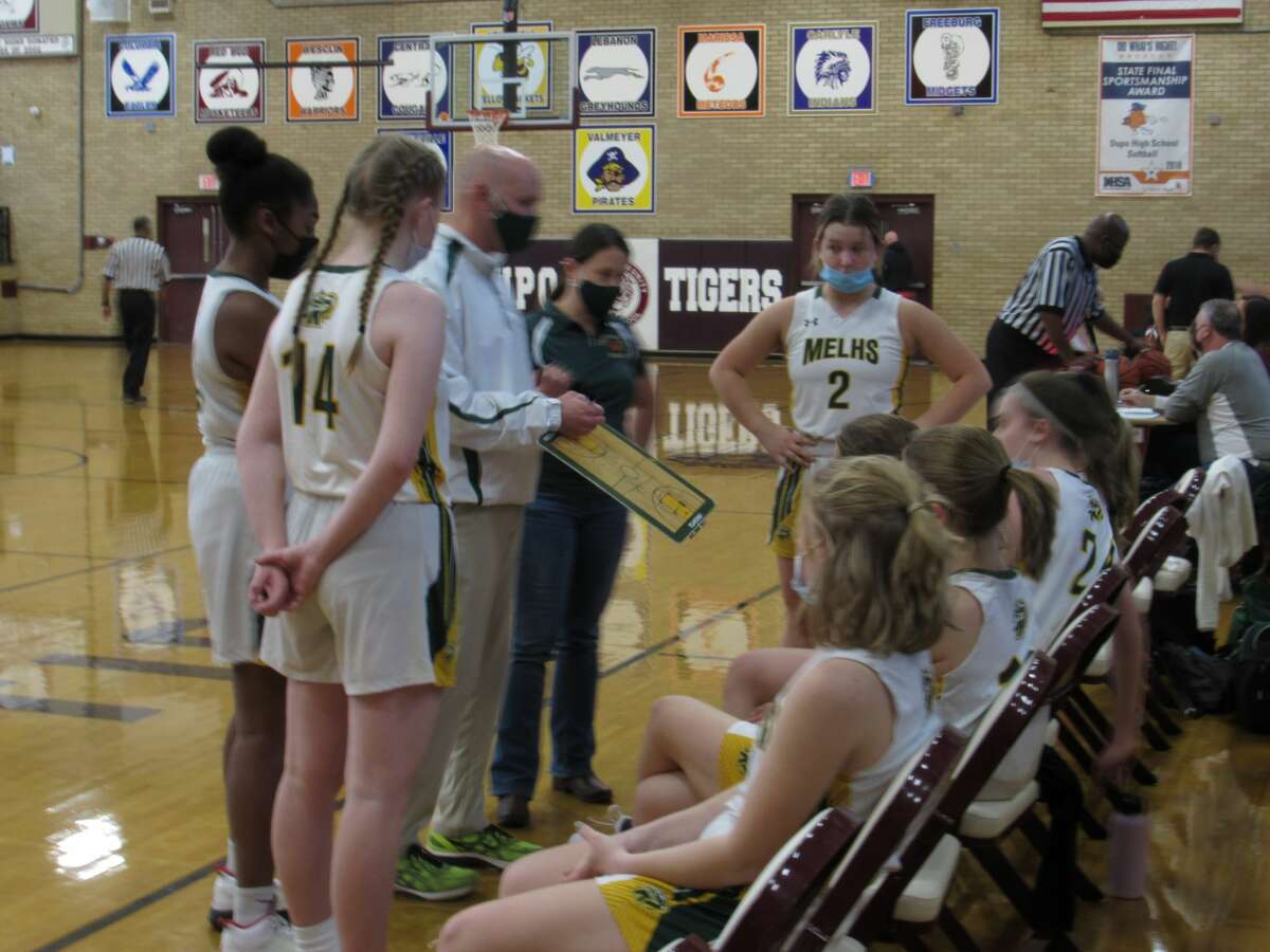 MELHS coach Rob Stock addresses the team during a timeout against Marissa on Nov. 20, 2021.