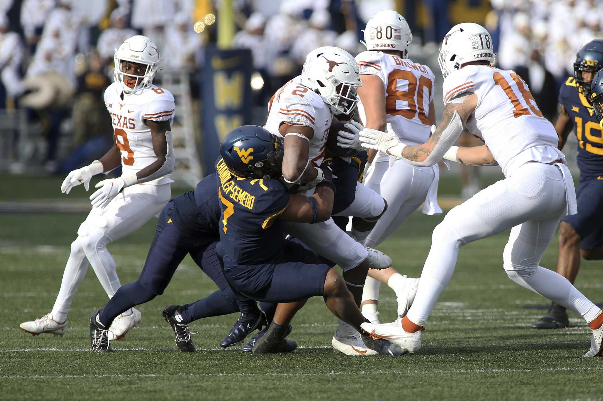 Texas star RB Bijan Robinson ruled out for remainder of the season with  dislocated elbow 